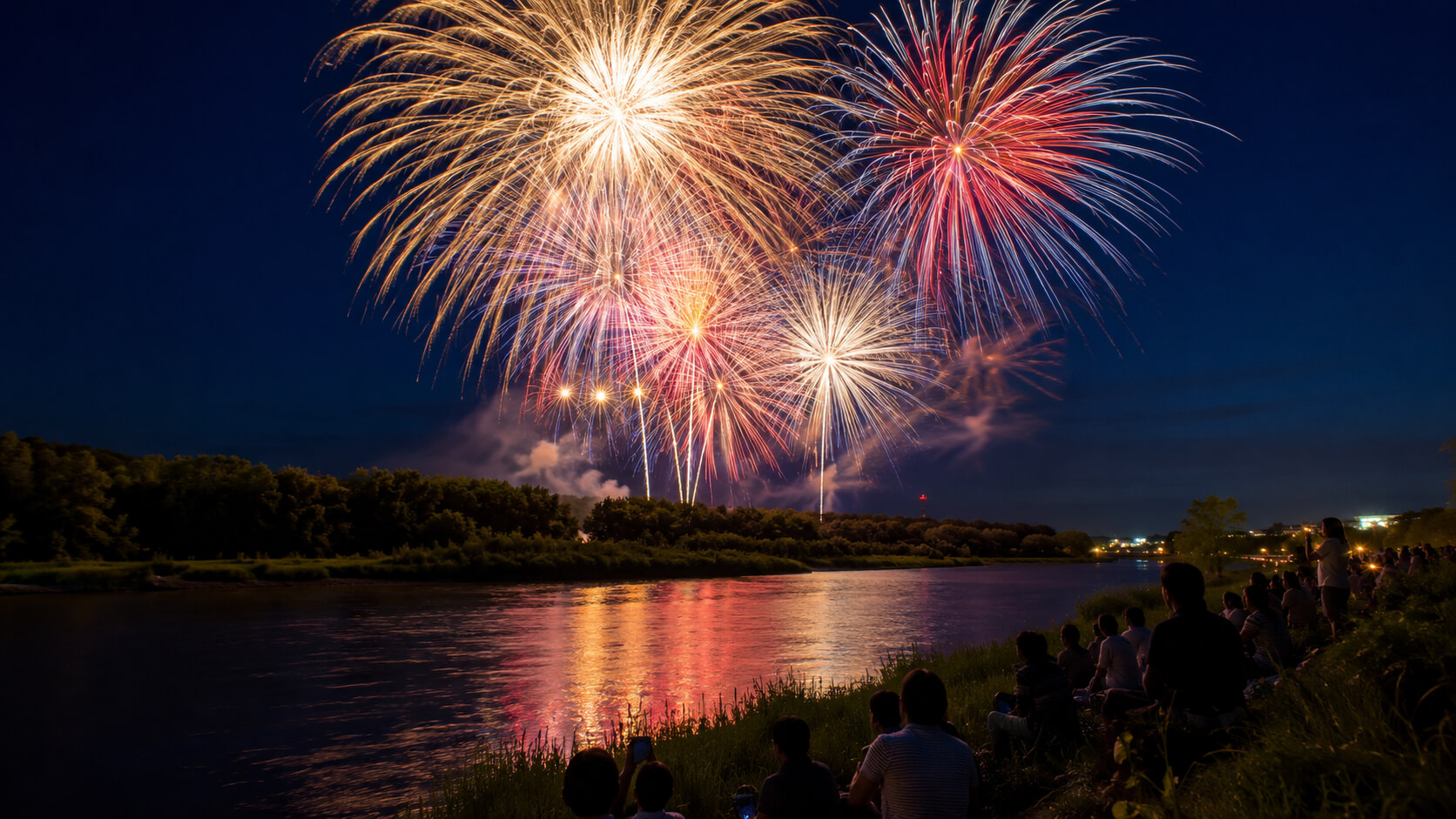 静内川の夜空に打ち上がる新ひだか夏まつりの花火